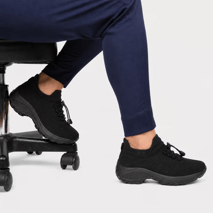 Cloud-Step orthopedic relief shoes worn with dark pants, lace-up black athletic style.